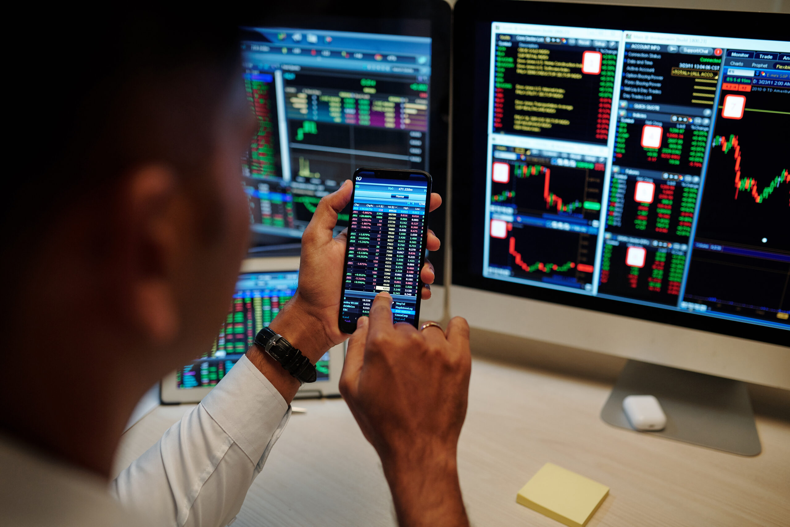 Man trading stocks via application